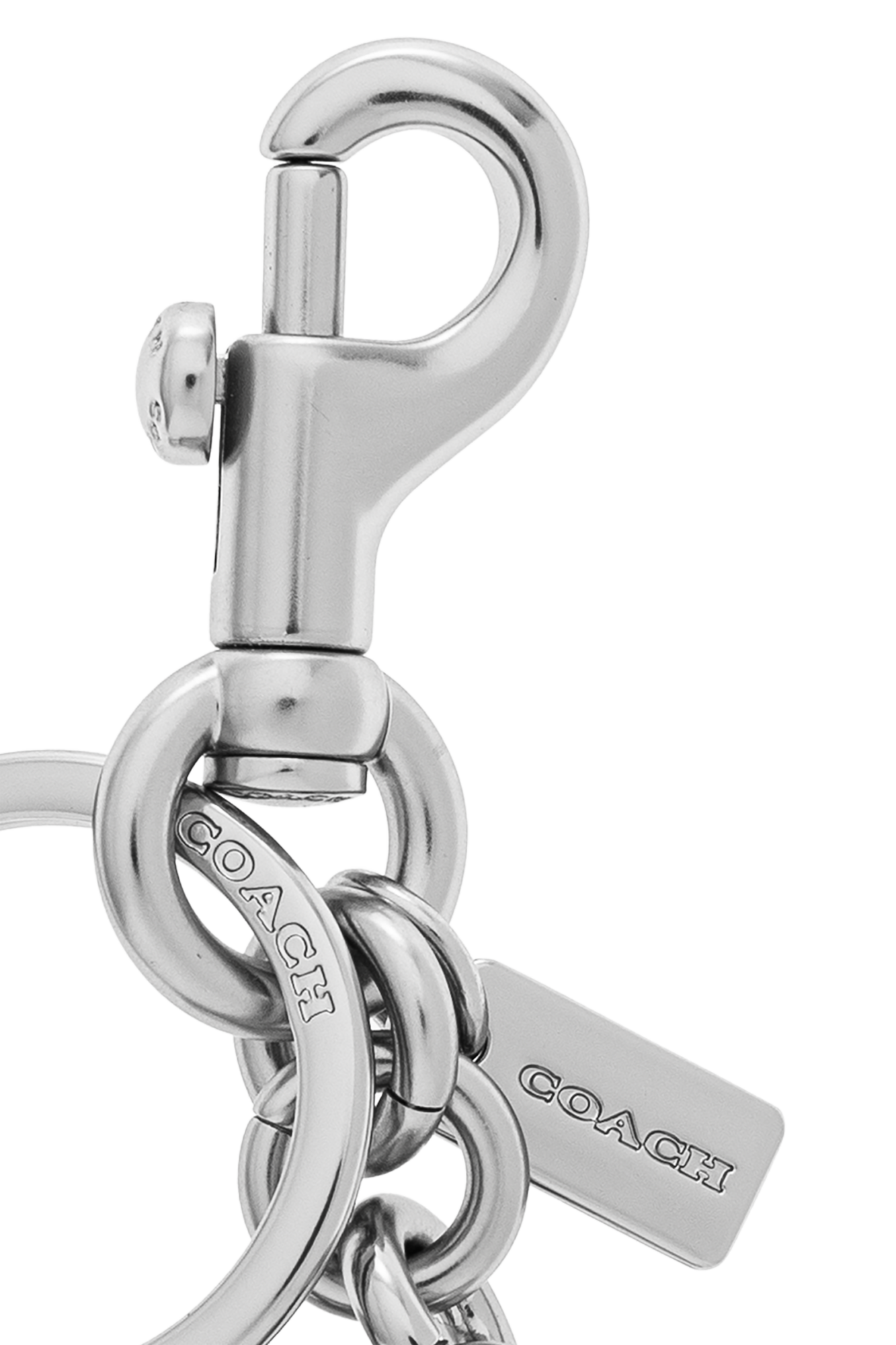 Silver Keychain with a pendant in the shape of a logo Coach